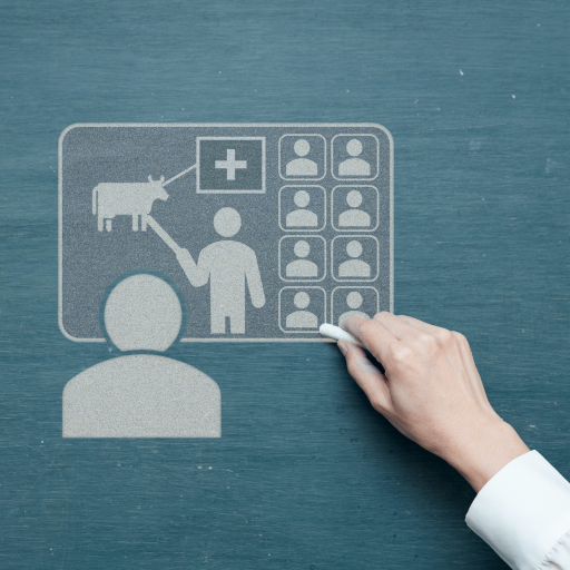 Hand drawing a hybrid face-to-face and virtual class group on a blackboard